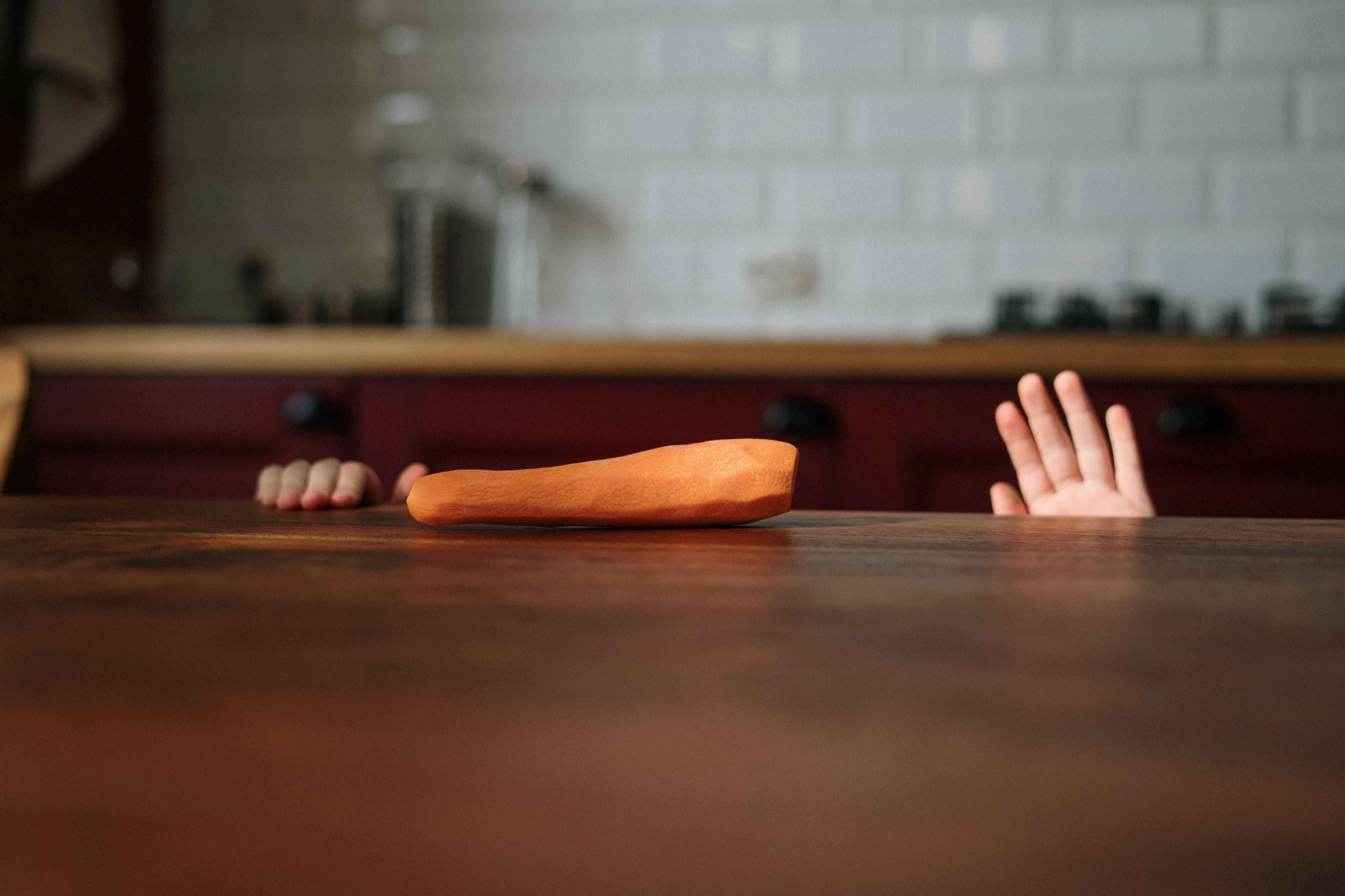 A child's hands at the kitchen counter